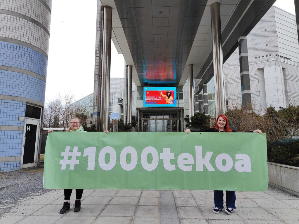1000tekoa -banneri Tampere -Talo